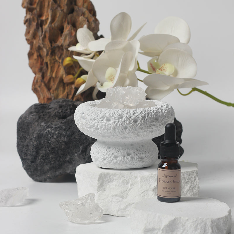 A tranquil environment featuring the White Moon Diffuser and coastal elements.