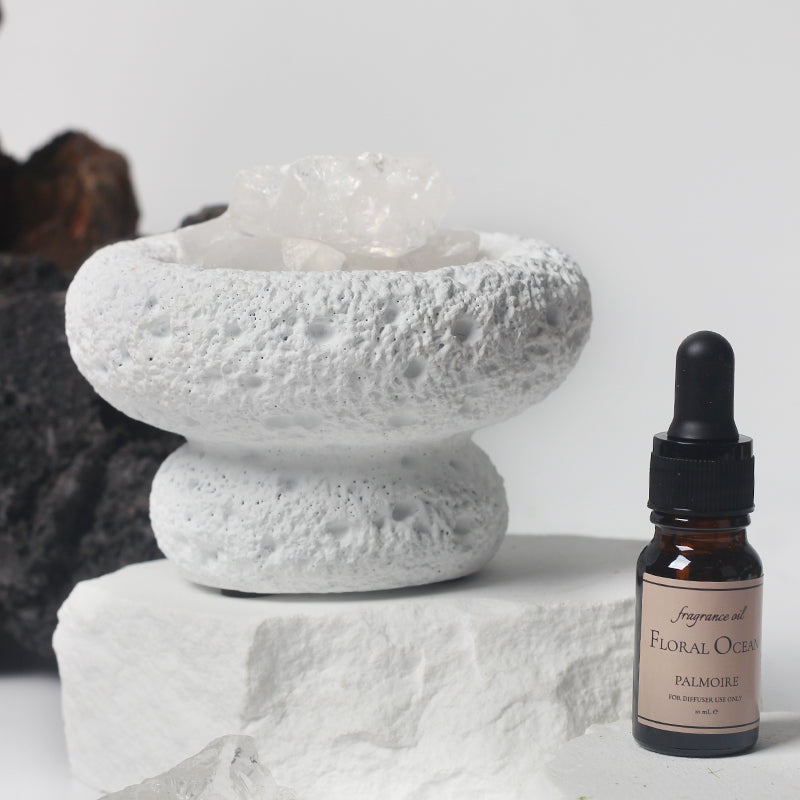 The White Moon Diffuser emitting a delicate mist, enhancing the serene atmosphere