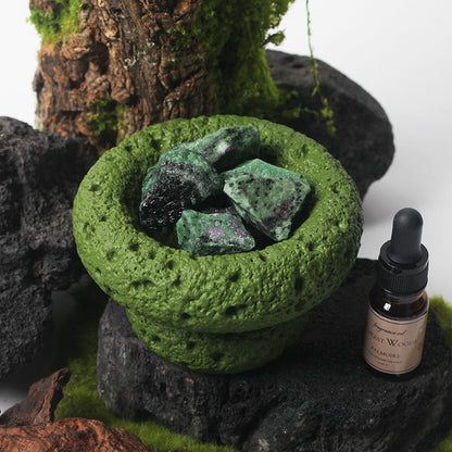 Close-up of the Green Moon Diffuser, highlighting its earthy color and texture.