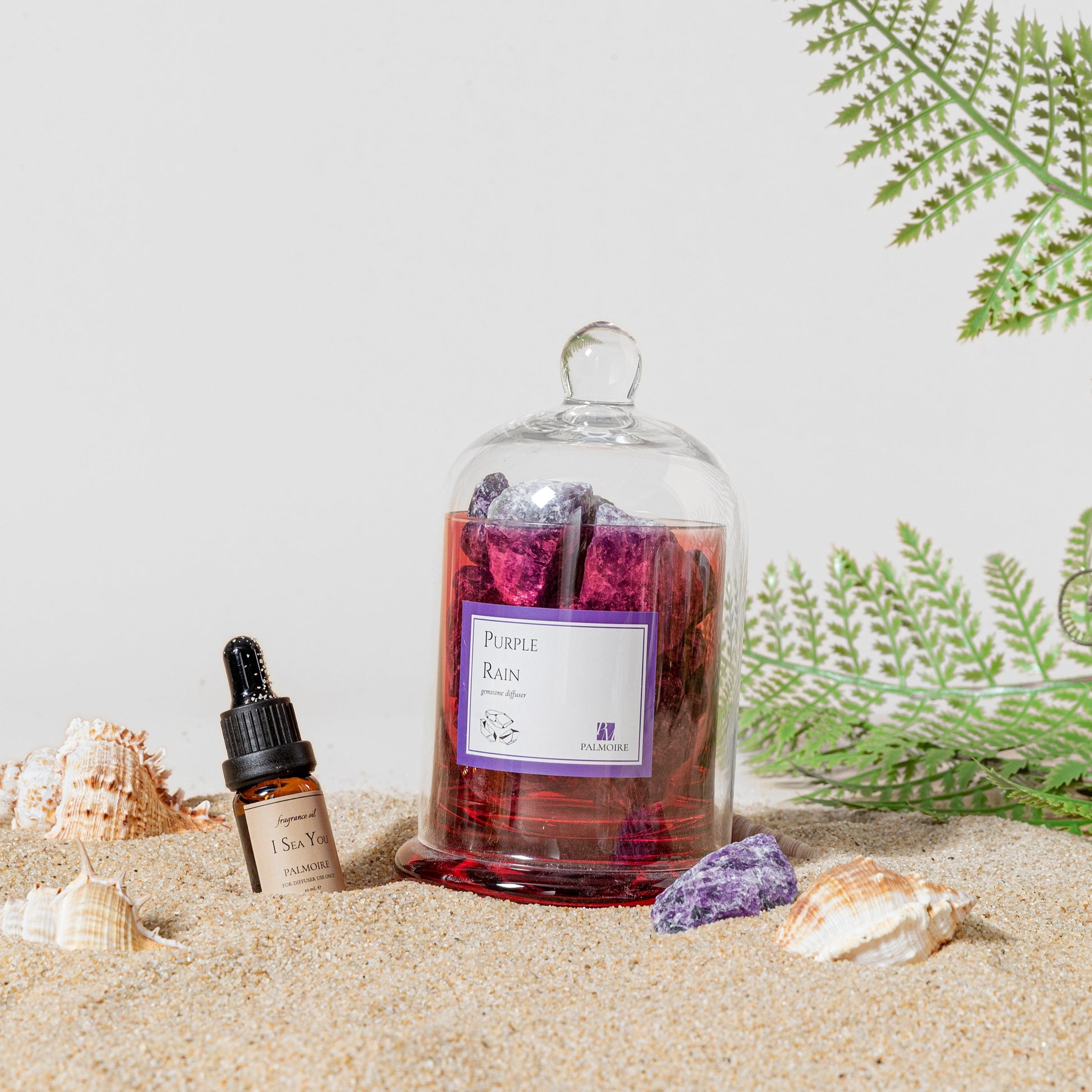 Purple Rain Gemstone Diffuser placed in a vibrant beach setting.