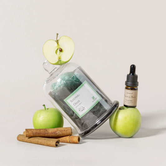 Sleeping Oasis Gemstone Diffuser styled with apples and cinnamon sticks